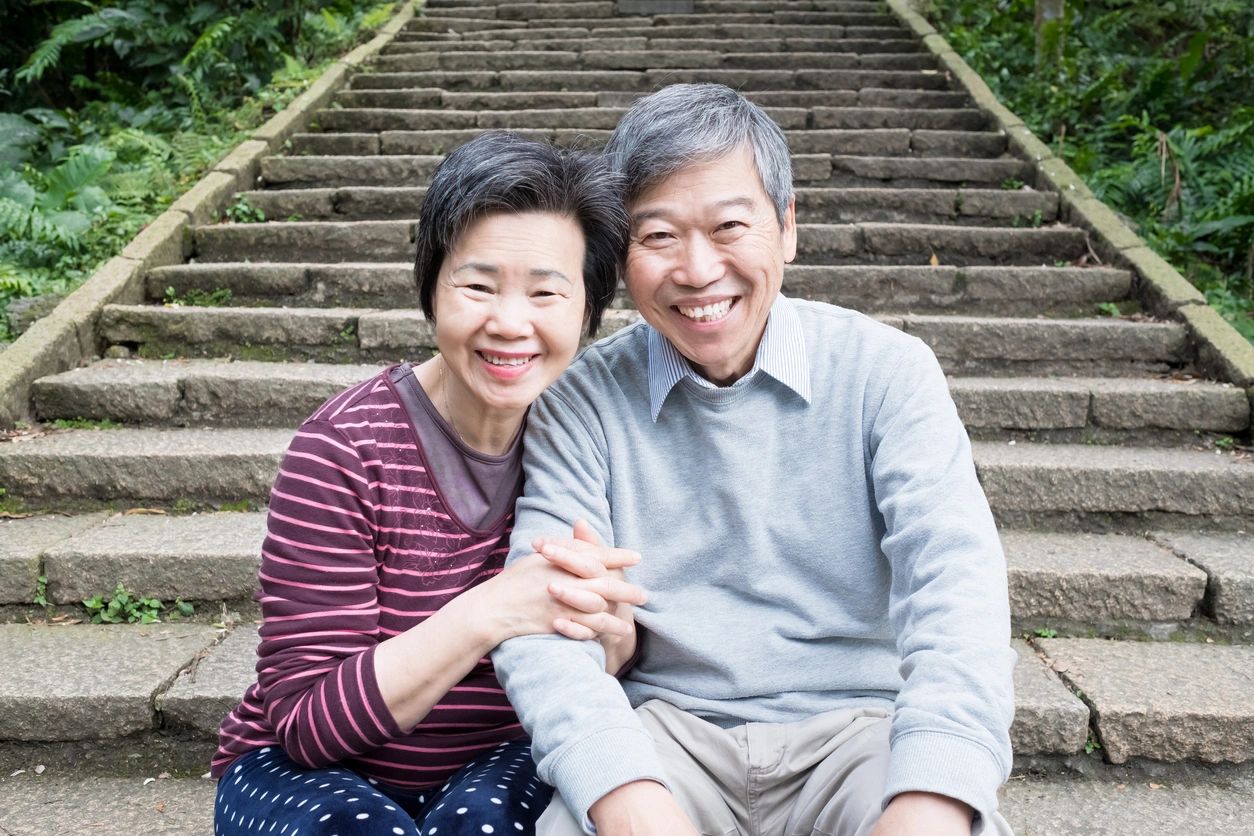 elderly couple by steps